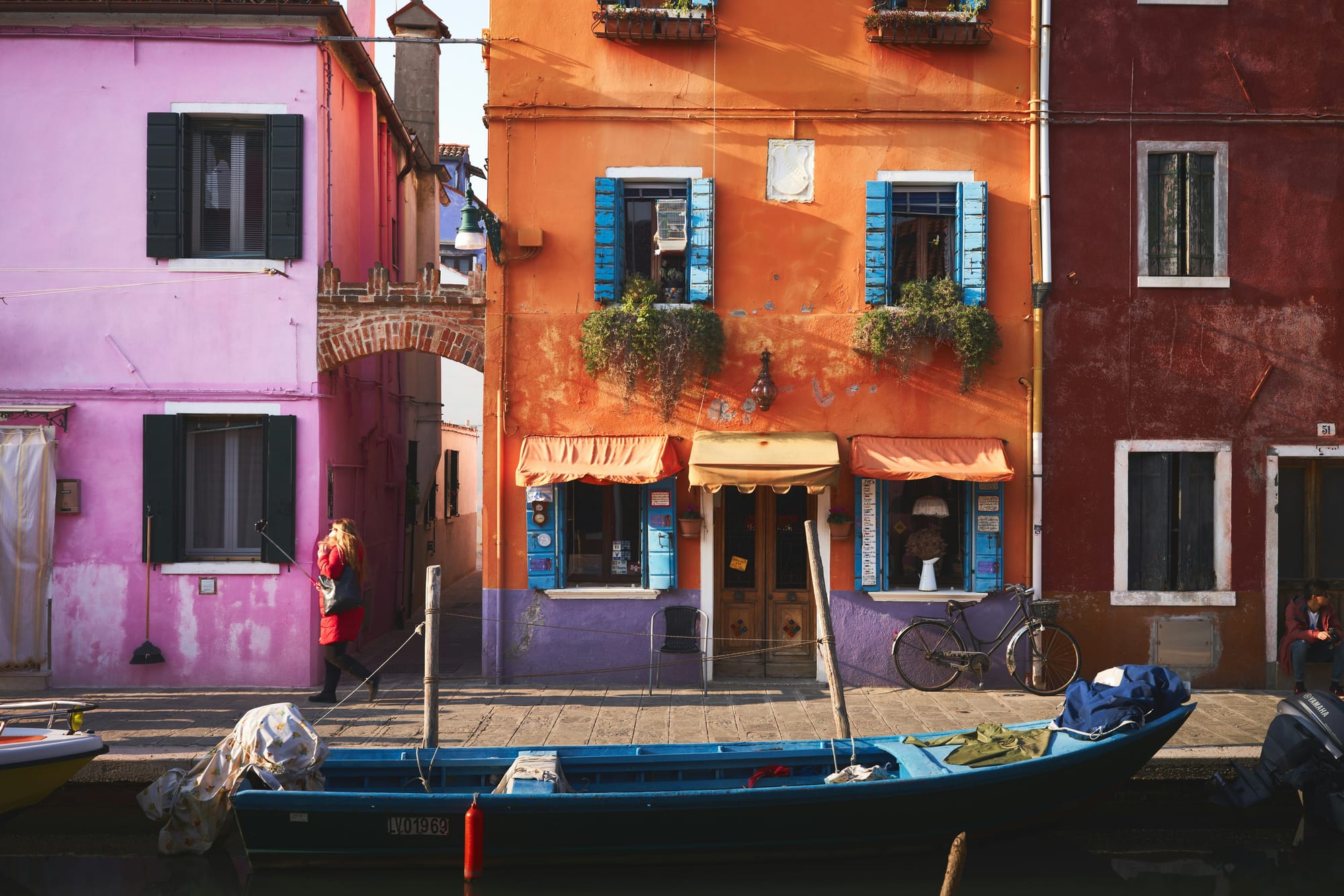 A quiet, authentic street in a small Italian village, representing cultural travel in Italy.