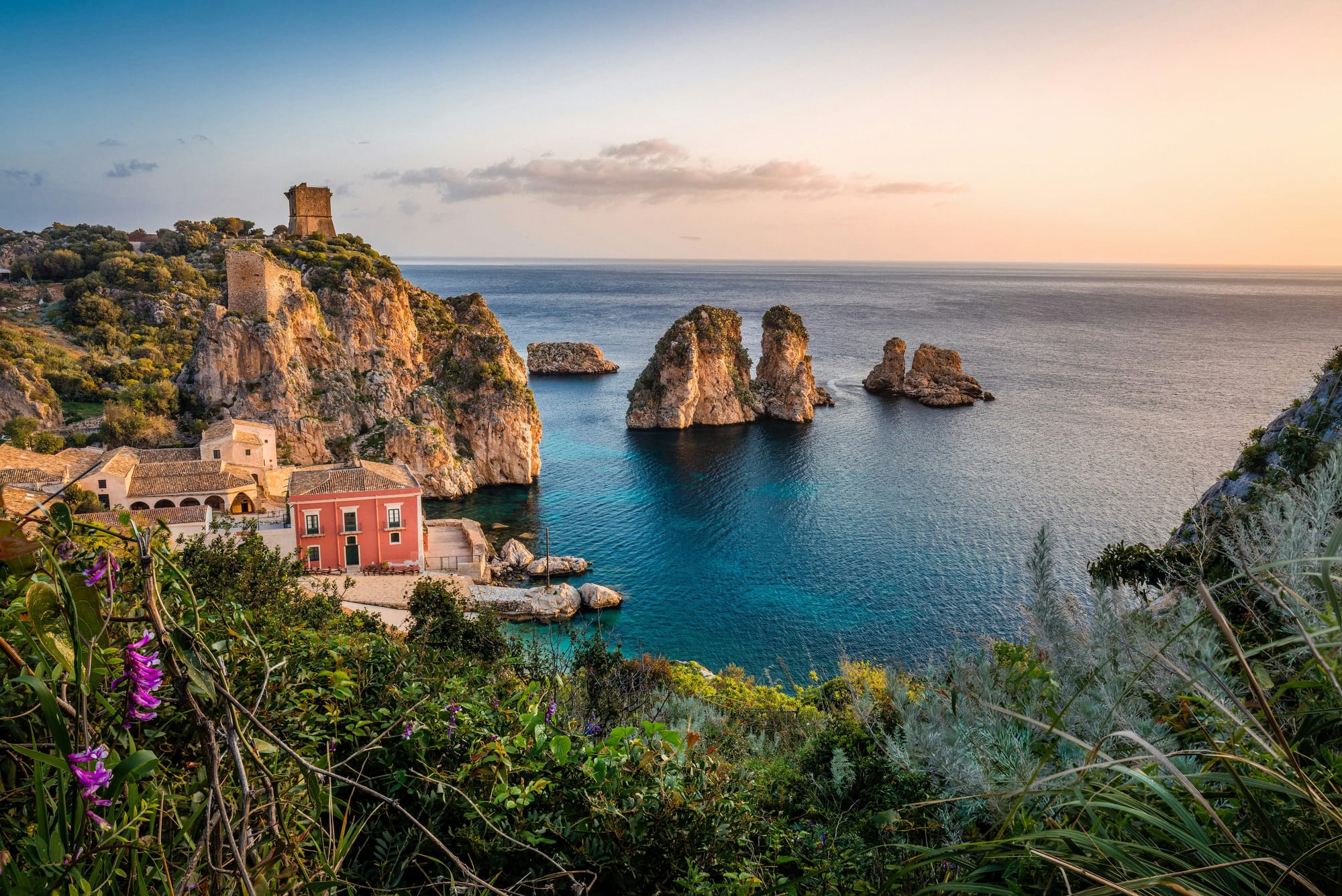A coastline in the golden light of May, illustrating the best time to visit Italy.
